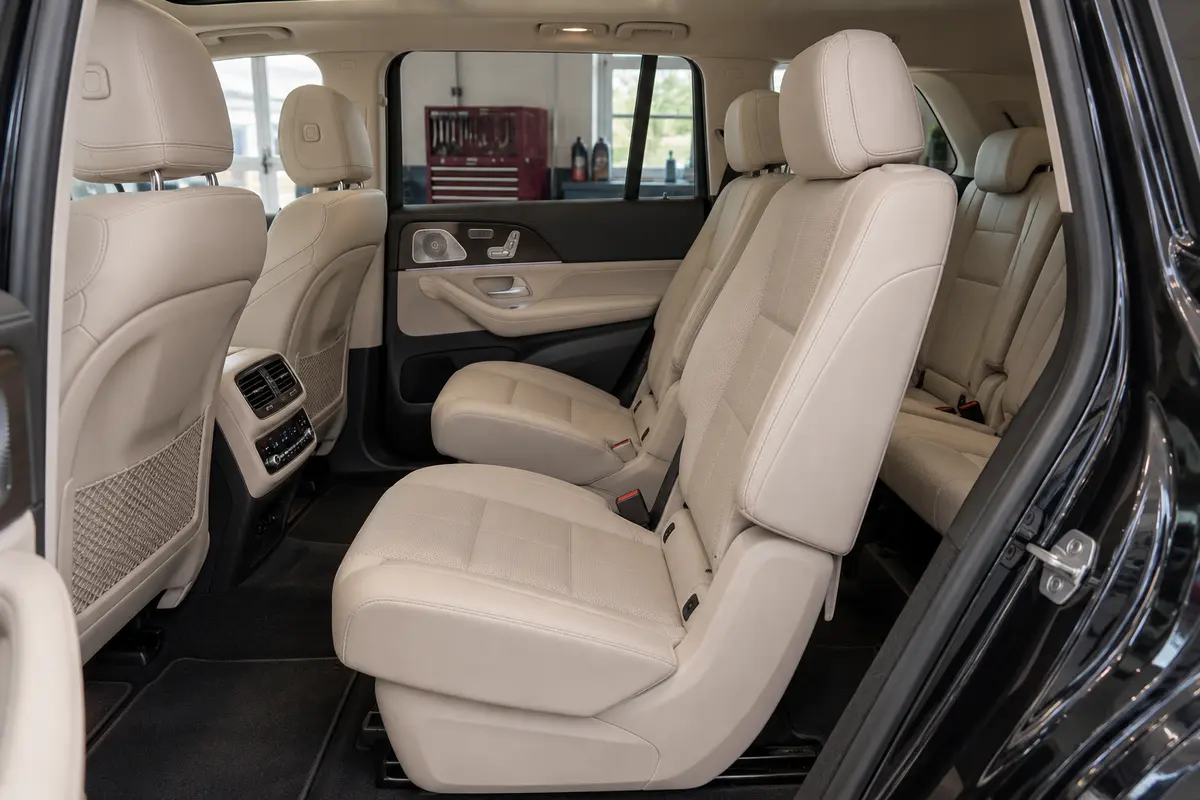 Beige Mercedes GLS450 X167 rear seating with center-console air vents