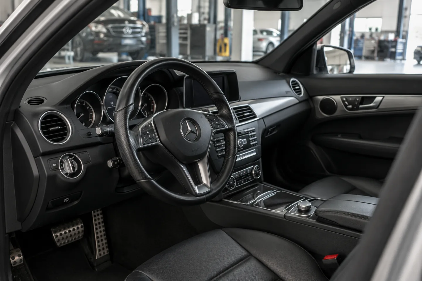 Mercedes cabin and steering wheel, illustrating a column repair booking
