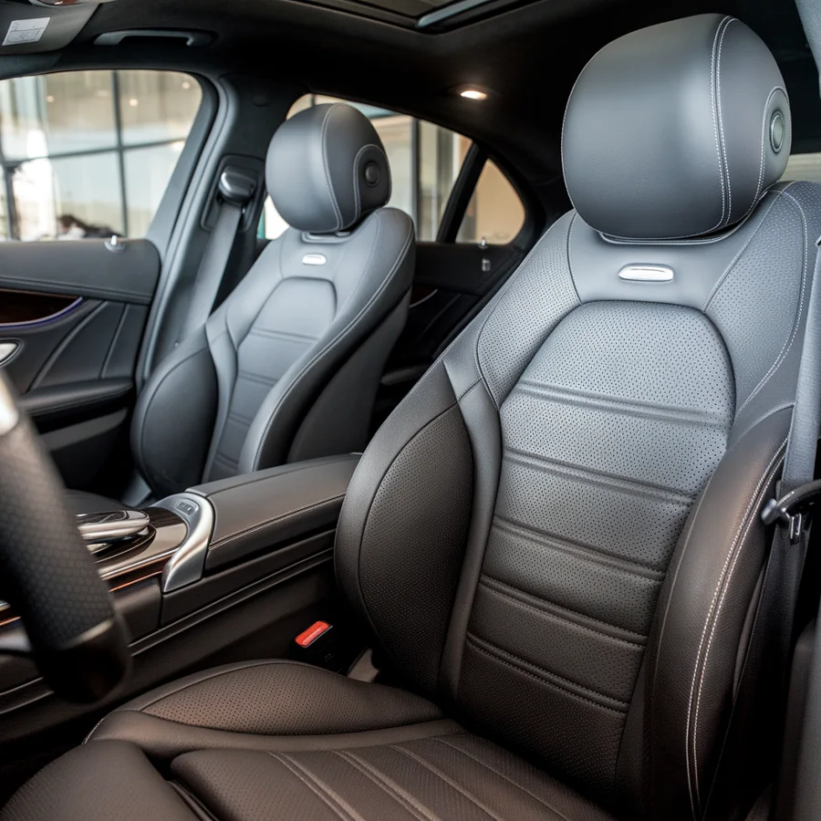 Black upholstered front seats inside a Mercedes cabin